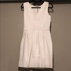 Cream v neck dress with beautiful rose back detail